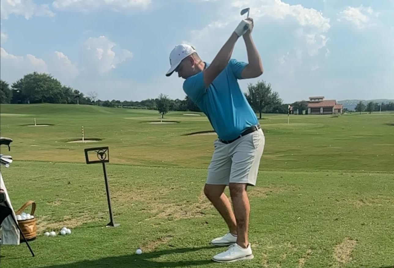 Mitchell Bozentka at the top of his backswing on the practice range at UT Golf Club